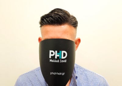 A Man With A Black Object Over His Face
