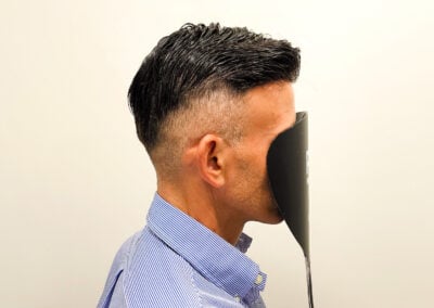 A Man With A Black Object Over His Face
